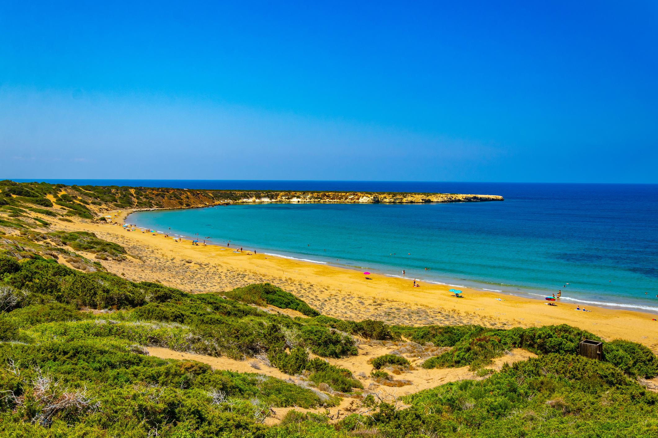 Lara Bay in Paphos, Cyprus, showing the protected golden sandy coastline of the Akamas Peninsula and the Mediterranean Sea.