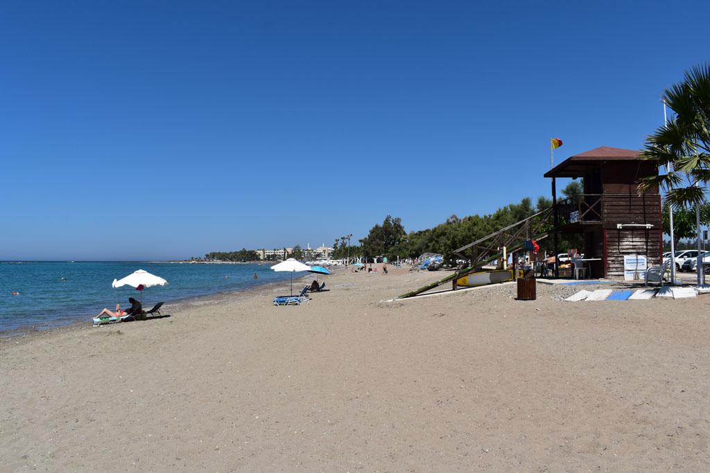 Geroskipou Municipal Beach near Paphos, Cyprus, with sandy shoreline, calm Mediterranean waters and facilities for visitors and families.